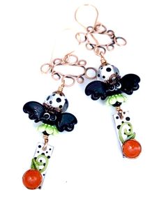 "Bat Earrings, BATS in the BELFRY, Halloween Earrings, Halloween Jewelry, Black and White, Lampwork Earrings, Twinkling Of An Eye, Polka Dot #725 BATS in the BELFRY These are fun, lightweight earrings that are perfect for Halloween, or really any time of the year. They feature Sabrina's lovely, polka-dotted enamel sticks, paired with fun, Artisan lampwork bats and Artisan polka dotted encased lampwork beads. I've added ceramic caps, copper caps, and Artisan copper connectors. They hang 3\" from Lion Earrings, Black And White Earrings, Bat Earrings, Winter Earrings, Halloween Necklace, Lampwork Earring, Rainbow Earrings, Halloween Earrings, Enamel Earrings