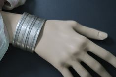 This old silver Turkmen (Turkoman) cuff was handcrafted during the early to mid-1900's for the Ersari sub-tribe. It is old collectible tribal jewelry, not a new reproduction. MEASUREMENTS: Wrist circumference = 7 inches (including gap) Wrist gap = 7/8 inch (narrow) Band width = 1-1/2 inch Weight = 1.8 ox Shipping weight = 6 oz TM Image library = 3-27-2023 With its clean lines and detailed band, it is characteristic of the old tribal-jewelry of the Ersari Turkmen group. 3 stylized-claws along the Mount Dora, Group 3, Central Asia, Clean Lines, The Old, Cuff Bracelets, Cuff, Bracelet, Silver