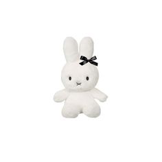 a white stuffed animal with a black bow on it's head, sitting in front of a white background