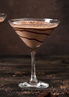 two martini glasses filled with chocolate and cinnamon