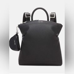 Handsfree Style Gets A Chic Makeover With Calvin Klein's Cypress Pebbled Faux Leather Small Backpack Small Sized Bag; 9-1/2"W X 10-1/2"H X 3"D (Width Is Measured Across The Bottom Of Backpack); 2ibs. Approx. Weight 5"L Top Handle; 25"L Adjustable Backpack Straps Zippered Closure Silver-Tone Hardware, Exterior Back Zip Pocket & Removable Pouch Interior Zip & Slip Pockets Modern Travel Backpack With Silver-tone Hardware, Modern Calvin Klein Bags With Silver-tone Hardware, Calvin Klein Leather Bags With Silver-tone Hardware, Everyday Backpack With Silver-tone Hardware, Modern Backpack With Gunmetal Hardware, Calvin Klein Leather Bag For On-the-go, Modern Calvin Klein Bags With Detachable Strap, Modern Black Calvin Klein Bag, Modern Calvin Klein Black Bag