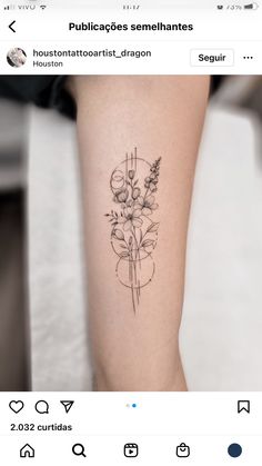 a small tattoo on the leg of a woman with flowers in her hand and an arrow