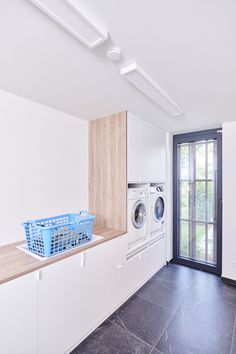 a laundry room with washer and dryer in it