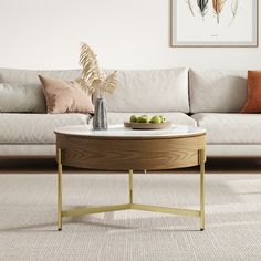 a living room scene with focus on the coffee table and white sofas in the background