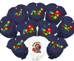 a bunch of shirts that say super mario on them