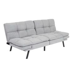 a gray couch with black legs on a white background