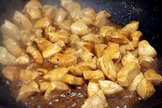 some food is cooking in a pan on the stove