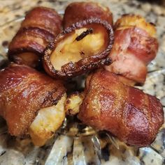 bacon wrapped in cheese on top of a marble counter