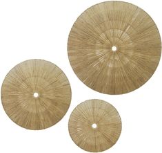 three round straw coasters sitting on top of each other