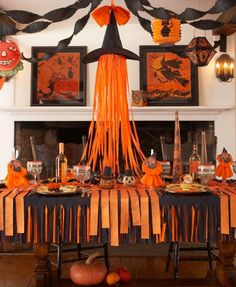 a table with decorations and pumpkins on it