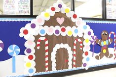 a large gingerbread house decorated with candy canes