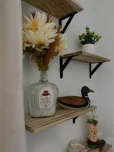 some shelves with flowers and bottles on them