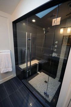 a walk in shower sitting inside of a bathroom