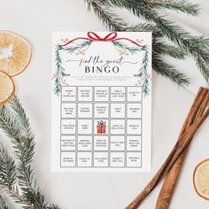 a printable christmas game with orange slices and cinnamons next to some cinnamon sticks