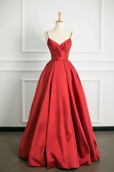 Make a bold statement at your next formal event with this Elegant Scarlet Satin Ball Gown. Designed to captivate, the gown features a sleek, fitted bodice with delicate spaghetti straps, creating a stunning silhouette that flatters the shoulders and neckline. The rich scarlet hue is both passionate and timeless, ensuring youll draw every eye in the room.The gowns waistline gracefully cinches to accentuate your figure before spilling into a luxuriously voluminous skirt. Crafted from high-quality satin, the material boasts a subtle sheen that catches the light with every movement, enhancing the gowns dramatic appeal. The full skirt adds a touch of classic romance and moves beautifully, making it perfect for dancing the night away.This ball gowns perfect blend of modern sophistication and cla Prom Ball Gown With Fitted Bodice And Spaghetti Straps, Prom Ball Gown With Spaghetti Straps And Fitted Bodice, Spaghetti Strap Ball Gown With Fitted Bodice For Prom, Elegant Spaghetti Straps Ball Gown, Elegant Fitted Ball Gown With Spaghetti Straps, Formal Spaghetti Strap Evening Dress For Prom, Fitted Spaghetti Strap Ball Gown For Evening, Formal Gown With Spaghetti Straps For Prom, Elegant Ball Gown With Spaghetti Straps