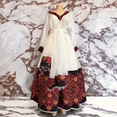 Beautiful Ethiopian and Eritrean Habeshan Dress. Stylish Menen, 100% Cotton We recommend hand washing and air drying to make it last longer. A low heating iron will also keep design and look. Cotton, it doesn't have a pocket. Eritrean Clothing, Eritrean Dress, Ethiopian Clothing, Ethiopian Jewelry, Ethiopian Traditional Dress, Ethiopian Dress, Habesha Kemis, Stone Mountain, African Attire