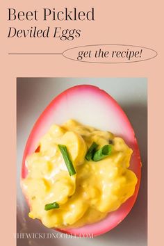 an egg with cheese on it and the words beet pickled deviled eggs get the recipe