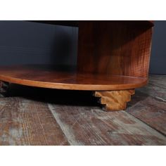 a wooden shelf sitting on top of a hard wood floor