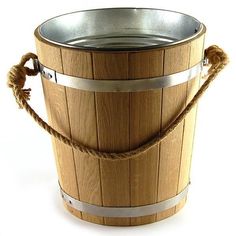 a wooden bucket with rope wrapped around the bottom and handle on an isolated white background