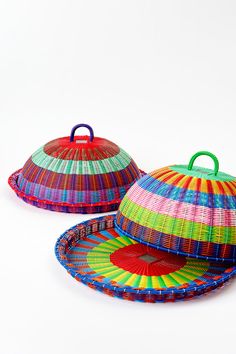 two colorful baskets sitting on top of each other