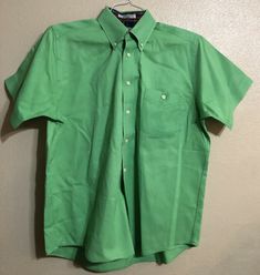 Approximate measurements Pit to pit 23-1/2” Length center back 30” Lightly starched Preowned, so may show signs of previous wear and laundering. Please see photos for actual condition and description. Thanks for looking! Classic Green Short Sleeve Shirt, Classic Green Collared Short Sleeve Shirt, Classic Green Shirt With Pockets, Fitted Green Button-up Short Sleeve Shirt, Green Cotton Short Sleeve Shirt With Buttons, Fitted Green Cotton Short Sleeve Shirt, Green Cotton Formal Shirt, Shirt Short Sleeve, Button Front Shirt