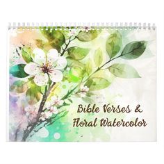 a spiral notebook with the words bible verses and floral watercolor