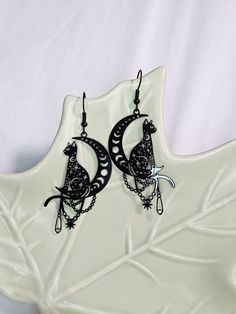 Cats have made some of the best familiars since the beginning of times it seems. These "purrfect" and magical charms are glossy black finish and very lightweight. Black finish wire hooks are hypoallergenic stainless steal. Magical Charms, Black Cat Earrings, Stainless Steal, Cat Earrings, Black Cat, Jewelry Earrings Dangle, Etsy Earrings, Dangle Drop Earrings, Dangle Earrings