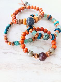 Beautiful mix of the southwestern color..rust, gold, pumpkin, browns, blue, sienna, touches of purple, green, and mustard. Lots of neutrals and tons of texture. Recycled glass, African bone beads, coconut disks, rustic wood, several Jasper and Agate varieties, Opal, Jade, sea shells, and more. Blended in with natural shell, fused glass, and bone beads. The item/s pictured is the item you will receive. Bracelets are 7.0" to 7.5" in length. Please let me know if you need a modification. This may d Earthy Multicolor Bracelet For Festival, Earthy Multicolor Bracelets For Festivals, Earthy Multicolor Festival Bracelets, Bohemian Brown Bracelets, Earthy Turquoise Bracelets For Festival, Bohemian Brown Beaded Bracelets, Handmade Earthy Multicolor Beaded Bracelets, Earthy Handmade Multicolor Beaded Bracelets, Handmade Multicolor Earthy Beaded Bracelets