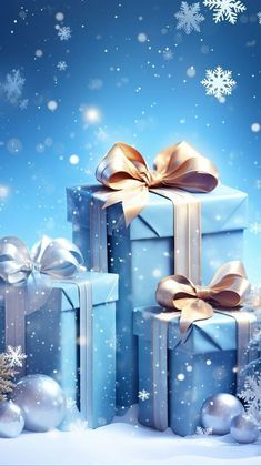 three blue wrapped presents with gold bows and snowflakes in the background, surrounded by christmas decorations