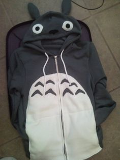 a black and white hoodie with eyes on it