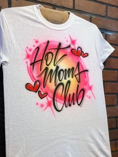 a t - shirt with the words hot mom's club painted on it