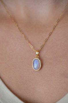 This stunning Moonstone Necklace is handmade with genuine natural large moonstone in an oval shape. An everyday classic piece of jewelry with a touch of modern, you will never regret investing in it. Perfect for layering with other gemstone chokers. Every stone has blue flash on its smooth surface. Securely set in our sleek and contemporary yet sturdy and bold bezel setting. Also available in sterling silver. D E T A I L S > Materials - Thick Nickel free gold & rose gold vermeil over .925 sterli Dainty Oval Jewelry With Natural Stones, Dainty Oval Natural Stone Jewelry, Minimalist Everyday Jewelry With Cabochon, Delicate Handmade Oval Jewelry, Minimalist Everyday Cabochon Jewelry, Oval Moonstone Jewelry For Everyday, Everyday Oval Moonstone Jewelry, Modern Oval Moonstone Jewelry, Oval Moon Charm Jewelry Gift