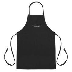 a black apron with the words yes chef written in white on it, against a white background