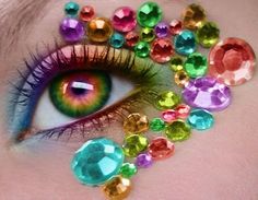 a close up of a woman's eye with colorful jewels on her face and the words custom listing