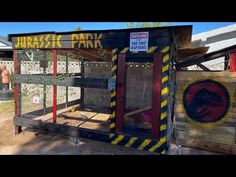 an outhouse made to look like a dinosaur park