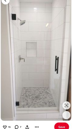 a white shower stall with black handles and no curtain on the door is shown in an instagram