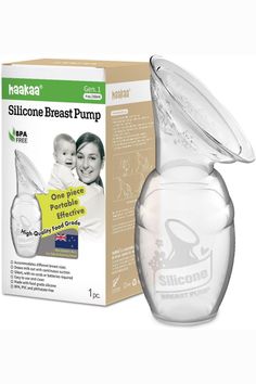 a glass breast pump in front of a box