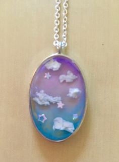 Pastel Sky Clouds Oval silver plated handmade resin pendant with 20 inch necklace made of solid brass. Hypoallergenic. Lead, nickel and cadmium free. Perfect for birthday or any occasion. Color may vary slightly. 20 Inch Necklace, Pastel Sky, Sky And Clouds, Sky Clouds, Oval Pendant, Resin Pendant, Pendant Necklaces, Solid Brass, Necklace Etsy