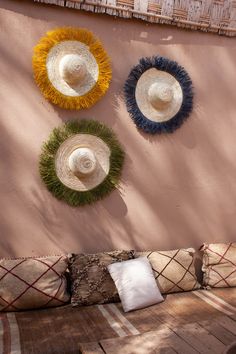 Moroccan straw hats with colorful raddia brim.