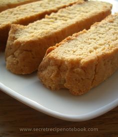 two pieces of bread sitting on top of a white plate