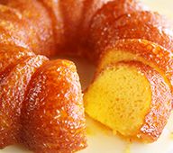 a bundt cake on a plate with one piece cut out