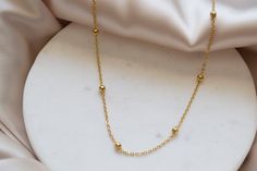 "Minimalist Satellite Chain necklace. A great piece to layer or just to wear alone when you just want to wear something lightweight and effortlessly TRENDY, handcrafted with a gorgeous 18k Gold Plated Stainless Steel satellite bead chain, making it the perfect piece for every day and absolutely every outfit. 18K GOLD PLATED STAINLESS STEEL: Hygienic, Tarnish-Resistant, and Hypoallergenic Quality and affordable. Stainless steel has many uses in the foodservice industry because of its hygienic pro Everyday Necklaces With Round Beads And Chain, Layering Beaded Necklaces With Adjustable Chain, Everyday Beaded Chain Necklace With Round Beads, Dainty Necklace With Round Beads Chain, Delicate Beaded Necklaces For Everyday Wear, Minimalist Beaded Chain Layered Necklace, Minimalist Everyday Beaded Chain Layered Necklace, Minimalist Beaded Chain Layered Necklace As Gift, Minimalist Necklace With Round Beads