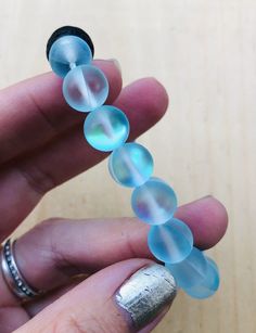 This listing is for one aqua glowing aura moonstone bracelet. This is a stretch bracelet. Glowing Aura, Kill Devil Hills Nc, Mermaid Glass, Aqua Aura, Moonstone Bracelet, Stretch Bracelet, Stretch Bracelets, Moonstone, Aura