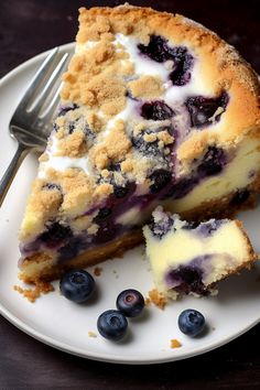 a piece of blueberry cheesecake on a plate with a fork