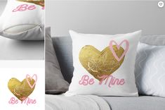 two pillows with hearts and the words be mine in pink, gold and white on them