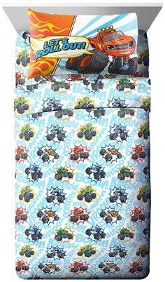 an image of a bed set with monster trucks on the sheets and pillowcases