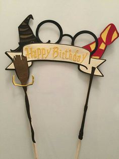 two harry potter wands with the words happy birthday on them and an owl hat