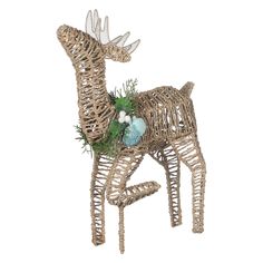 a deer made out of wicker sitting on top of a white background