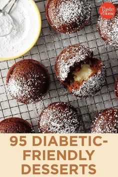 some desserts on a cooling rack with powdered sugar in the middle and an orange bowl next to them