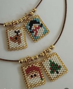 three pieces of beaded necklaces on a brown cord